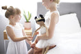 Load image into Gallery viewer, wo young girls playing with a handmade doll in a cozy bedroom setting
